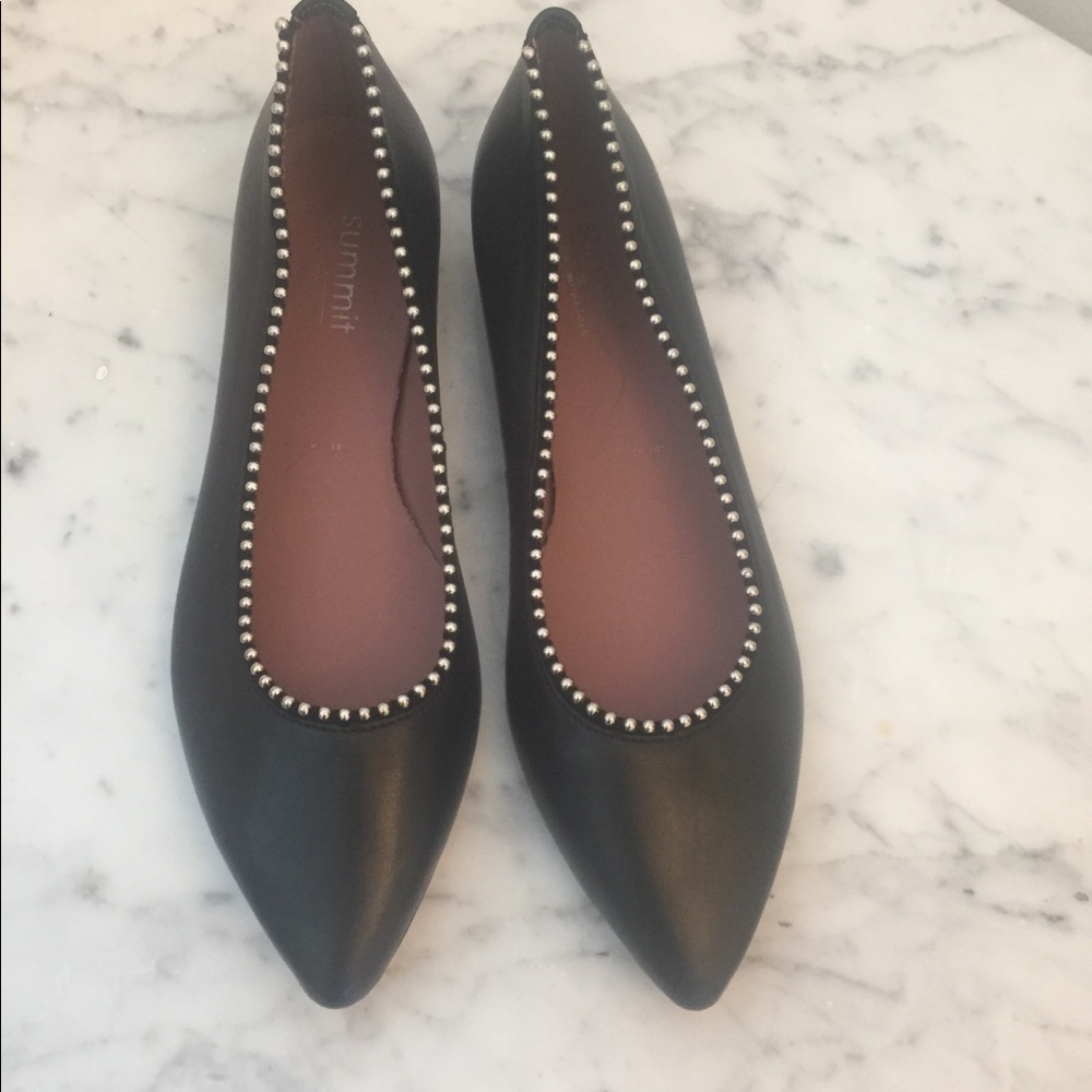 Italian leather flat with sliver detail.